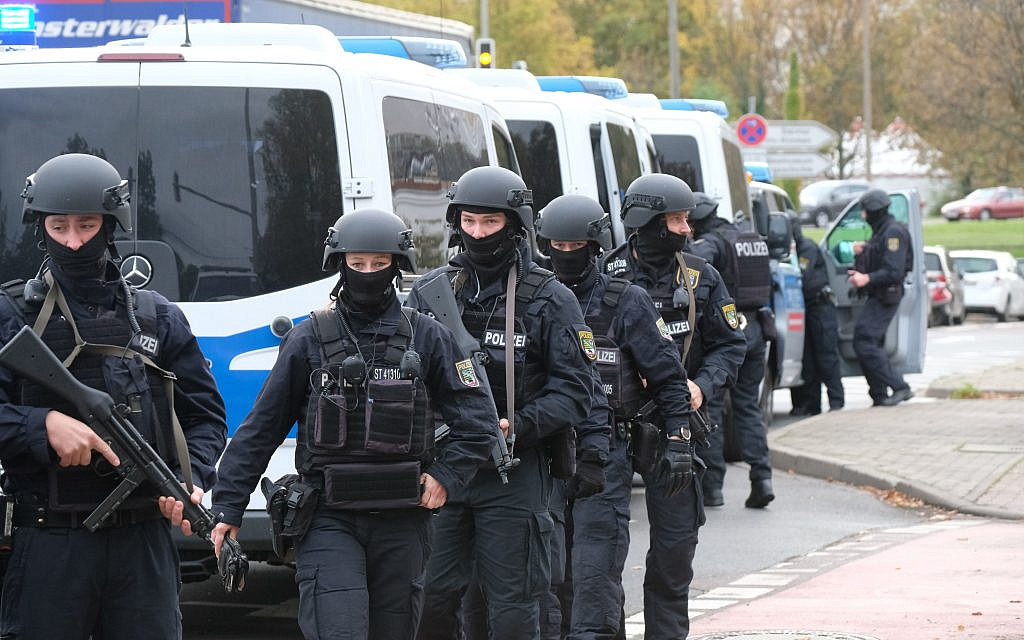 Police officers walk on a road in Halle, Germany, Wednesday, Oct. 9, 2019 in wake of the Halle attack (Sebastian Willnow/dpa via AP) Police officers walk on a road in Halle, Germany, Wednesday, Oct. 9, 2019 in wake of the Halle attack (Sebastian Willnow/dpa via AP)