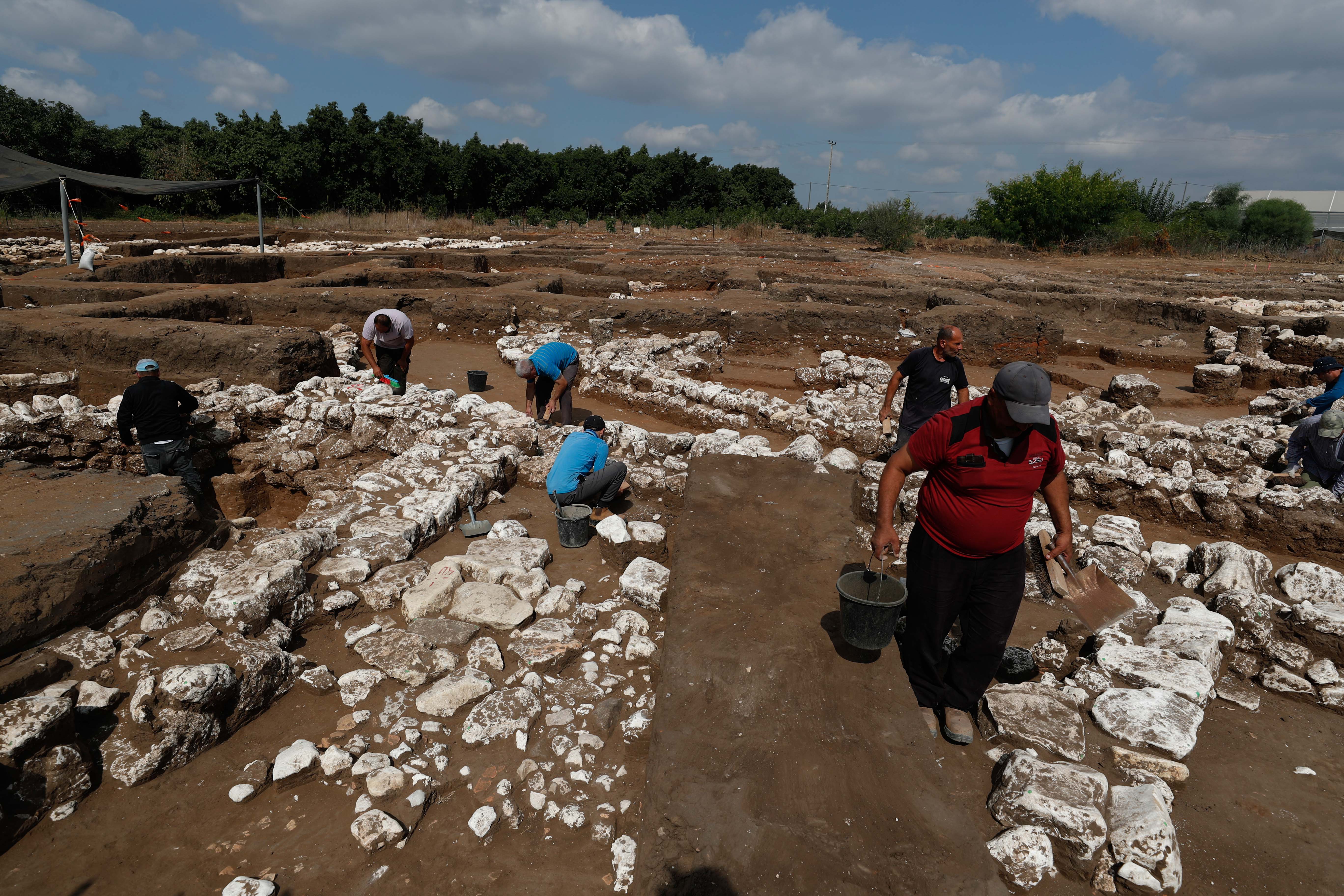Israeli archaeologists work at the ancient site of En Esur (Ein Asawir) where a 5000-year-old city was uncovered, near the Israeli town of Harish on October 06, 2019. Photo by: JINIPIX