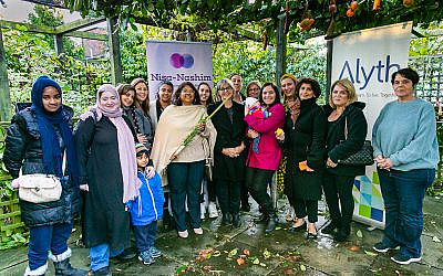 Jewish and Muslim women in a show of unity after the Halle terror attack, with Hifsa Haroon-Iqbal in the centre holding a lulav and etrog.  (Yakir Zur via Jewish News)