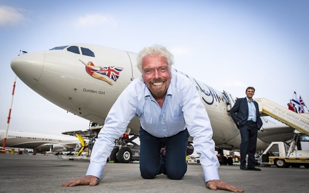 Virgin Atlantic founder Richard Branson kisses the tarmac after he touches down at Ben Gurion Airport in Tel Aviv, Israel
