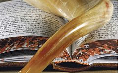 Shofar on top of a prayer book Shofar on top of a prayer book