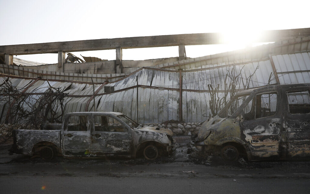 Burnt cars sit after a Tuesday's rocket firing from Gaza, in Sderot, southern Israel, Wednesday, Nov. 13, 2019. Gaza officials say new Israel airstrikes have killed a few militants. (AP Photo/Ariel Schalit)