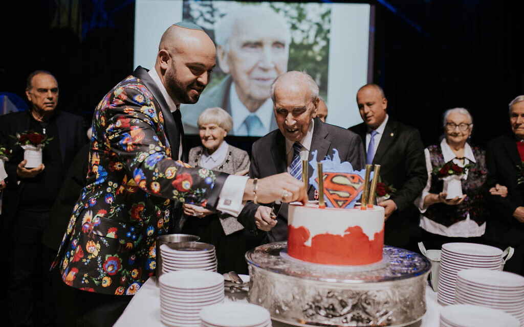 Jozef Walaszczyk cutting his 100th birthday as Righteous Among the Nations were honoured in Warsaw