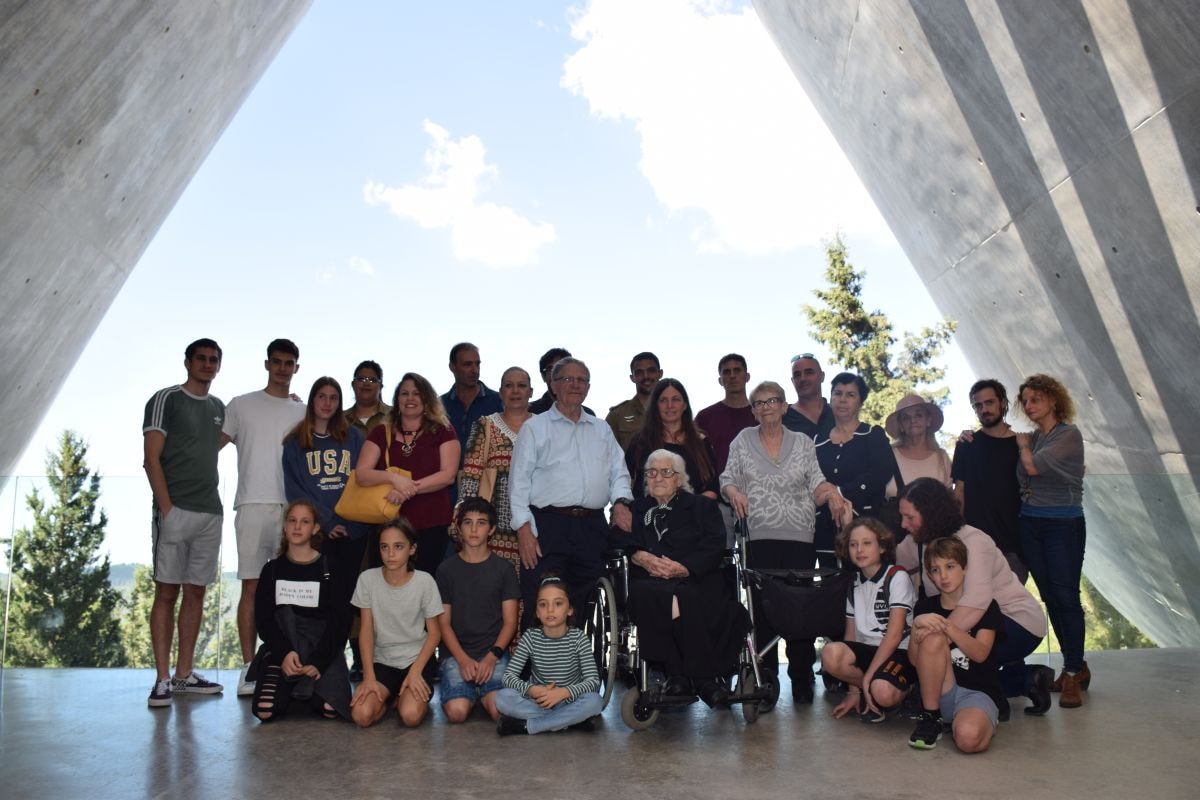 Descendants of the Mordechai family and Righteous Among the Nations rescuer Melpomeni Dina on the balcony exiting from Yad Vashem's Holocaust History Museum
 (Credit: Yad Vashem)