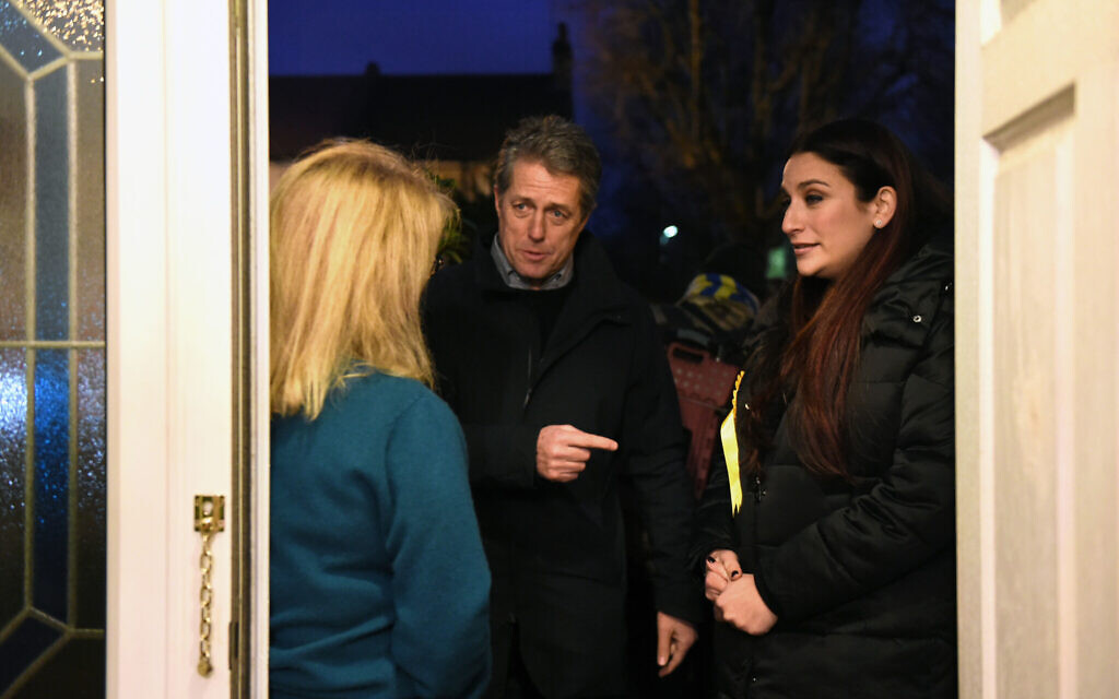 Hugh Grant canvassing with (right) Liberal Democrat candidate for Finchley and Golders Green, Luciana Berger (Credit: David Mirzoeff/PA Wire)