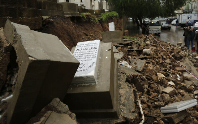 Graves in a Jewish cemetery sit damaged from heavy rains in the Sodeco area of Beirut, Lebanon, Thursday, Dec. 26, 2019.  (AP Photo/Hassan Ammar)