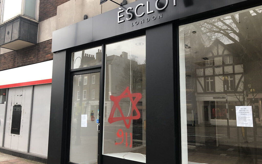 Photo taken from the Twitter feed of @OliverCooper showing anti-semitic graffiti on a shop in Hampstead, North London. (Photo credit: @OliverCooper/PA Wire)
