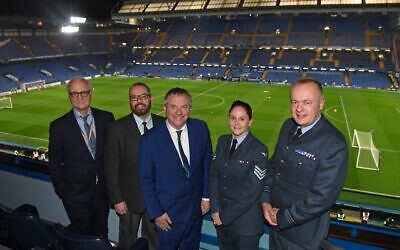 L-R: Bruce Buck, Chelsea Chairman, Armed Forces Chaplain Rabbi Reuben Livingstone, Lord John Mann, and two representatives from the RAF Museum at Stamford Bridge