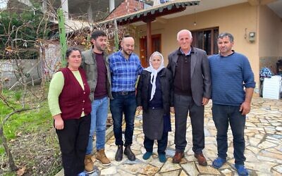 Daniels (third from left) with elderly Albanians affected by the earthquake