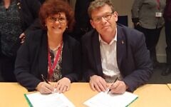 BGU Rector Prof. Chaim Hames (right) and Prof. Dimitra Simeonidou of the University of Bristol sign the MOU on Monday. (Photo Credit: Daphna Frucht/British Embassy Israel) BGU Rector Prof. Chaim Hames (right) and Prof. Dimitra Simeonidou of the University of Bristol sign the MOU on Monday. (Photo Credit: Daphna Frucht/British Embassy Israel)