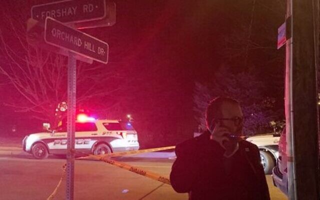Police car in the background of the response to the Monsey attack, as a figure from the local ADL is on the scene (Credit: ADL New York / New Jersey on Twitter)