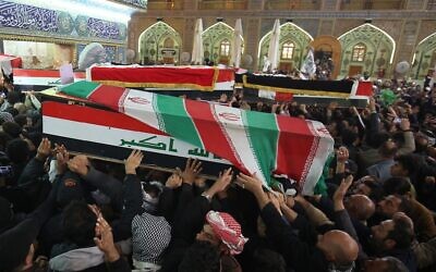 Mourners carry the coffins of Iran's Gen. Qassem Soleimani and Abu Mahdi al-Muhandis, deputy commander of Iran-backed militias at the Imam Ali shrine in Najaf, Iraq, Saturday, Jan. 4,  (AP Photo/Anmar Khalil)