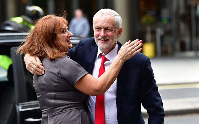Jeremy Corbyn and Karie Murphy outside the Labour Party HQ in Westminster, London. (Photo credit: Dominic Lipinski/PA Wire)