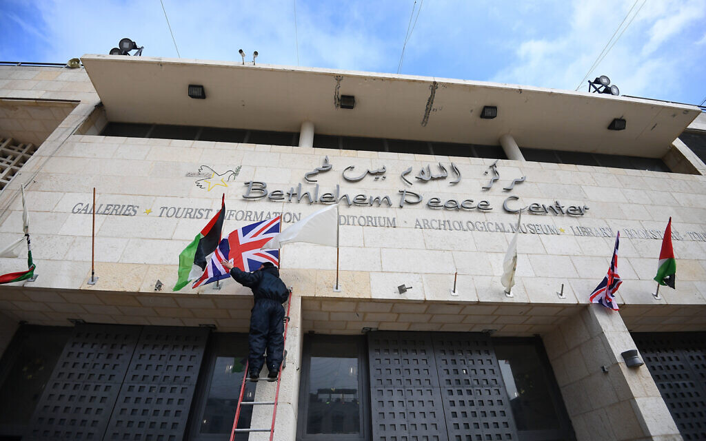 A Union Flag is hung outside the Bethlehem Peace Center in Manger Square, Bethlehem, ahead of the arrival of the Prince of Wales on the second day of his trip to Israel and the occupied Palestinian territories. (Photo credit: Victoria Jones/PA Wire