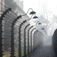 People arrive for commemorations at the Auschwitz Nazi death camp in Oswiecim, Poland,  (AP Photo/Czarek Sokolowski)