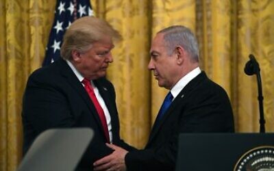 Donald Trump embraces Benjamin Netanyahu during a meeting in Washington