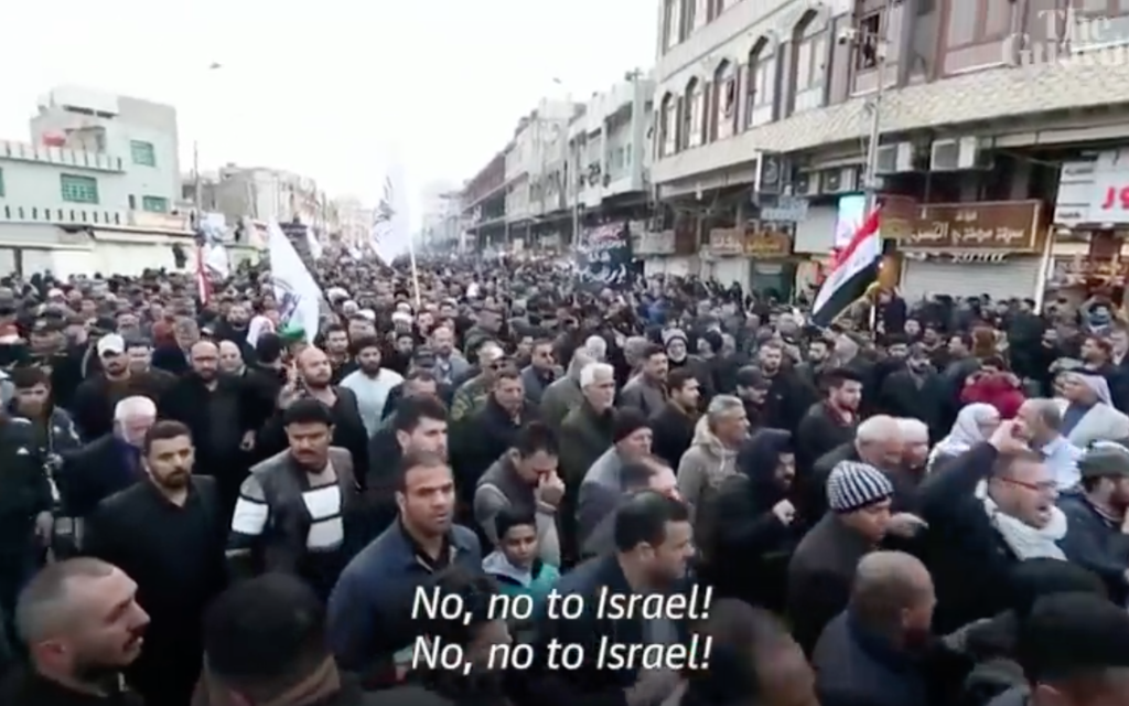 Funeral procession in Baghdad for Qassem Soleimani (Screenshot from YouTube video by The Guardian)