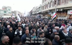 Funeral procession in Baghdad for Qassem Soleimani (Screenshot from YouTube video by The Guardian)