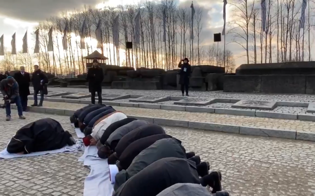 Senior Muslim leaders, including Muhammad bin Abdul Karim al-Issa, joined children of survivors at Auschwitz-Birkenau (Credit: Twitter video, American Jewish Committee)