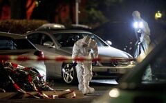 Forensics investigate at the scene after a shooting in central Hanau, Germany Thursday, Feb. 20, 2020. Eight people were killed in shootings in the German city of Hanau on Wednesday evening, authorities said. (AP Photo/Michael Probst) Forensics investigate at the scene after a shooting in central Hanau, Germany Thursday, Feb. 20, 2020. Eight people were killed in shootings in the German city of Hanau on Wednesday evening, authorities said. (AP Photo/Michael Probst)