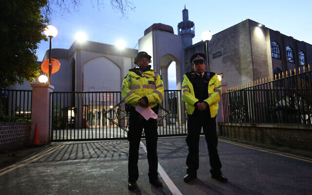 Police officers outside the main entrance to the London Central Mosque near Regent's Park, North London, after morning prayers. (Photo credit: Jonathan Brady/PA Wire)