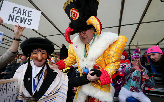 Aalst mayor Christoph D'Haese (R) and a Jewish caricature pictured during the yearly carnival parade in the streets of Aalst, Sunday 23 February 2020, starting on Sunday with the so-called Zondagsstoet.