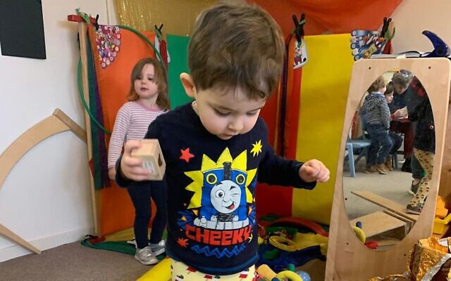 Coby Gold practising circus skills in the nursery's Purim event