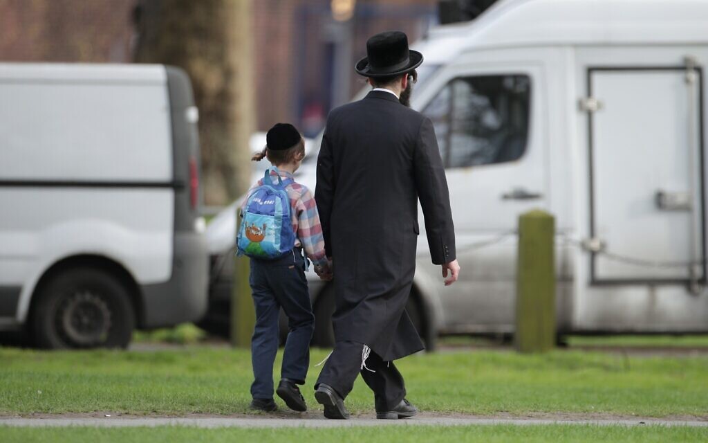 A general view of a Jewish man and a child in Stamford Hill. This image is not related to the article it illustrates.