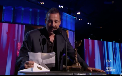 Screenshot from Youtube of awards ceremony, where Adam Sandler picked up the 'best male lead' gong