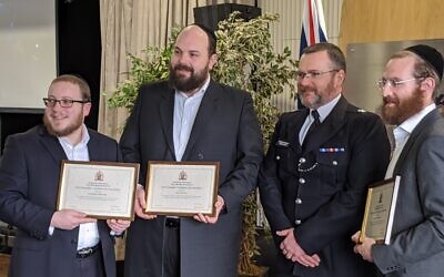 Chief Superintendent Louis Smith, with Gary Ost, Shimon Ostreicher and Shmuel Danciger