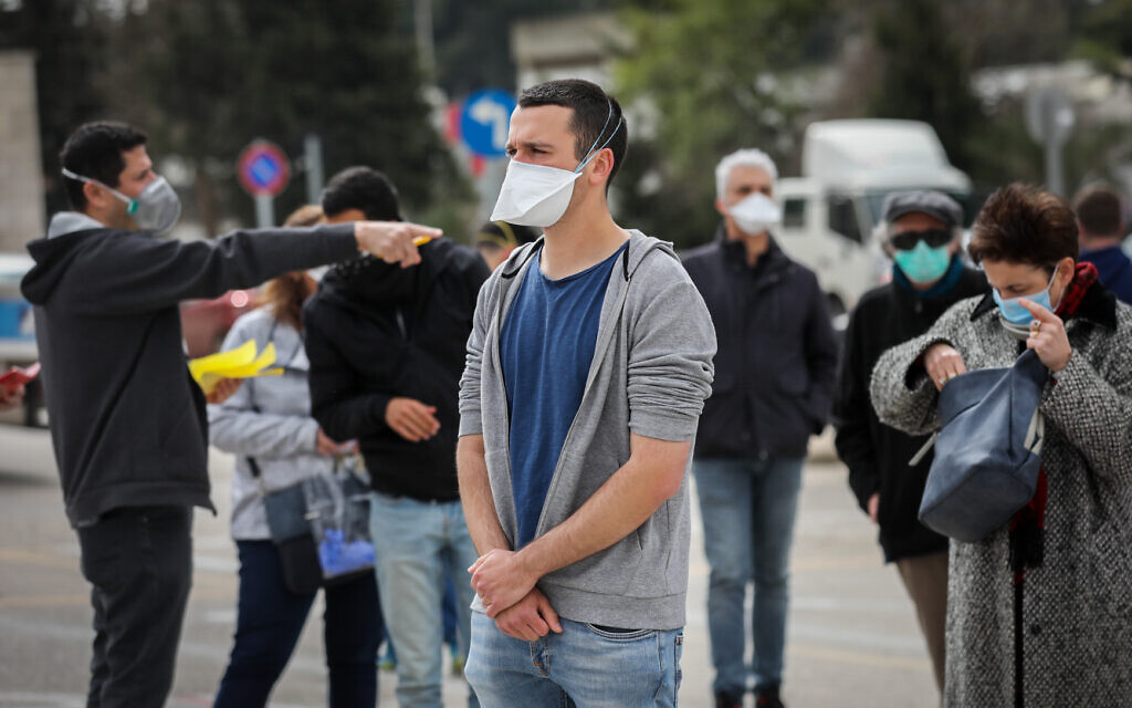 People arrive to vote at a special polling station for voters quarantined due to possible exposure to the new coronavirus in Jerusalem, during the Knesset Elections, on March 2, 2020.    Photo by: JINIPIX