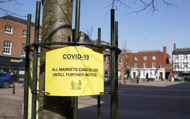 A Covid-19 sign in Lichfield warns people to engage in social distancing. Photo credit: Morgan Harlow/PA Wire