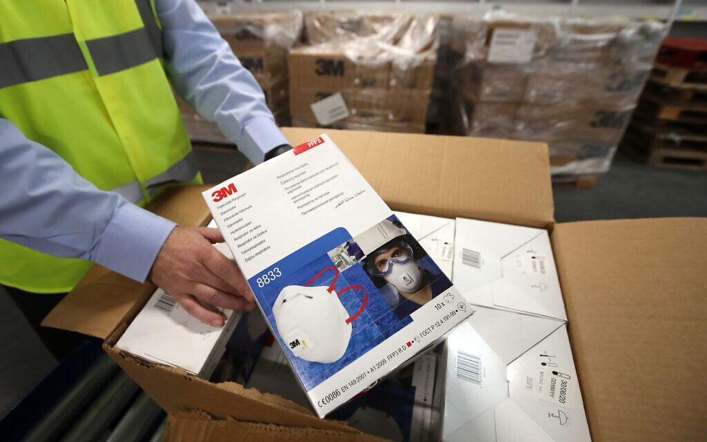 Jim Miller, procurement director from NHS National Services Scotland, holds a box of face masks in Canderside, Larkhall. (Photo credit should read: Andrew Milligan/PA Wire)