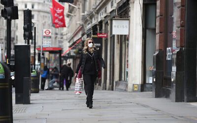 A woman wearing a face mask in Regents Street in London