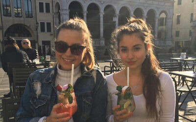 Rebecca and her friend Fiona sipping spritzes in the main square of Padova
