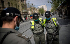 Israelis wearing protective masks due to the COVID-19 pandemic.  Photo by: JINIPIX