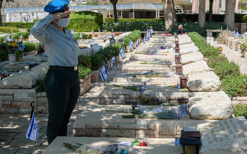 Israeli soldiers at Mount Qiryat Shemona Cemetery as Israel marks Memorial Day for the fallen soldiers and victims of terror on April 28, 2020. This year, due to the outbreak of the Coronavirus, there will be restrictions on going to the cemeteries on Memorial Day itself. Photo by: Ayal Margolin-JINIPIX