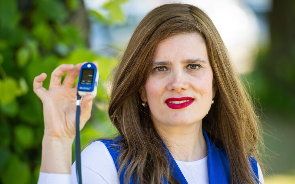 Doctor Sharon Raymond who set up the Urgent Oximeter Rescue service, with a oximeter oxygen saturation probe in Brent Park, north west London. (Dominic Lipinski/PA Wire) Doctor Sharon Raymond who set up the Urgent Oximeter Rescue service, with a oximeter oxygen saturation probe in Brent Park, north west London. (Dominic Lipinski/PA Wire)