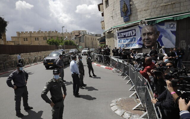 Israeli Prime Minister Benjamin Netanyahu's convoy arrives to Jerusalem district court In Jerusalem, Sunday, May 24, 2020. (AP Photo/Sebastian Scheiner)