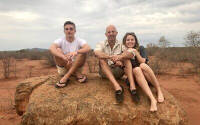 Dad Jeremy (centre) with his son Olly and daughter Lizzie