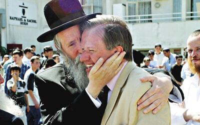 Sherard Cowper-Coles gets a warm greeting from Rabbi Grossman of Migdal HaEmek