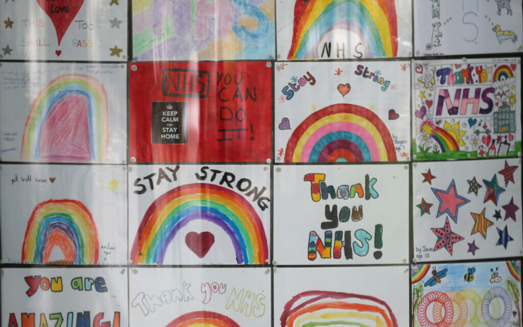 Drawings in support of the NHS in the windows of a college opposite St Thomas' Hospital in London as the UK continues in lockdown to help curb the spread of the coronavirus. Picture date: Friday May 8, 2020.