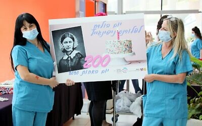 Rambam nurses with gifts celebrating Florence Nightingale's 200th birthday