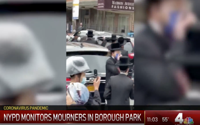 Screenshot from NBC New York's video, of the funeral procession being interrupted by Police. (https://www.nbcnewyork.com/on-air/as-seen-on/video-shows-nypd-breaking-up-group-of-mourners-at-holocaust-survivors-funeral/2397657/)