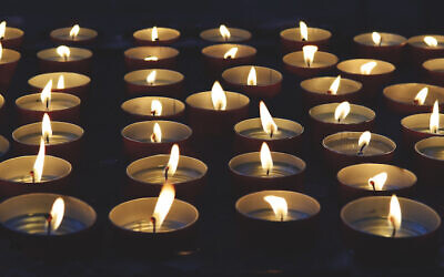 burning memorial candles on the dark background