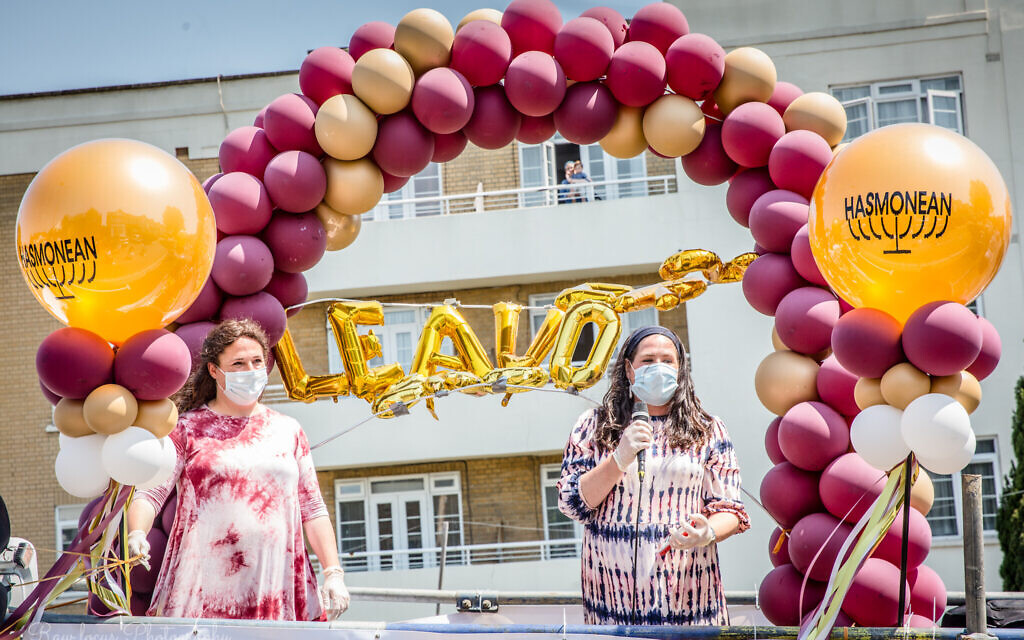 L-R Hasmonean deputy heads of sixth form Yael Hamer and Debbie Paster give speeches on the float (Credit: Dina Erlich/RAWfocus)
