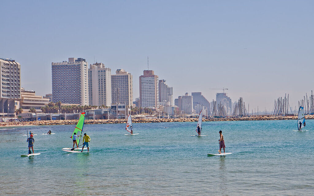 Surfing on Tel Aviv's famous coastline 
 (Credit: Dana Friedlander for the Israeli Ministry of Tourism.)