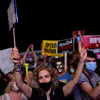 An anti-government protester clad in mask due to the COVID-19 coronavirus pandemic chants slogans during a demonstration in Charles Clore Park in the Mediterranean coastal city of Tel Aviv on July 18, 2020, protesting against the Israeli government and the PM for the broken promises made by the Israeli government during the novel coronavirus pandemic Photo by: Tomer Neuberg-JINIPIX