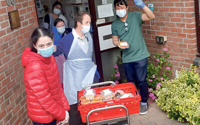 Charity volunteers deliver meals to those in need during the coronavirus lockdown
