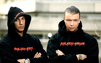 Bang (left) with fellow rapper Kollegah, 2009 (Wikipedia/ Source: Selfmade Records. Author: Lars Henning Schroeder/ Attribution-ShareAlike 2.0 Generic (CC BY-SA 2.0)  https://creativecommons.org/licenses/by-sa/2.0/legalcode)